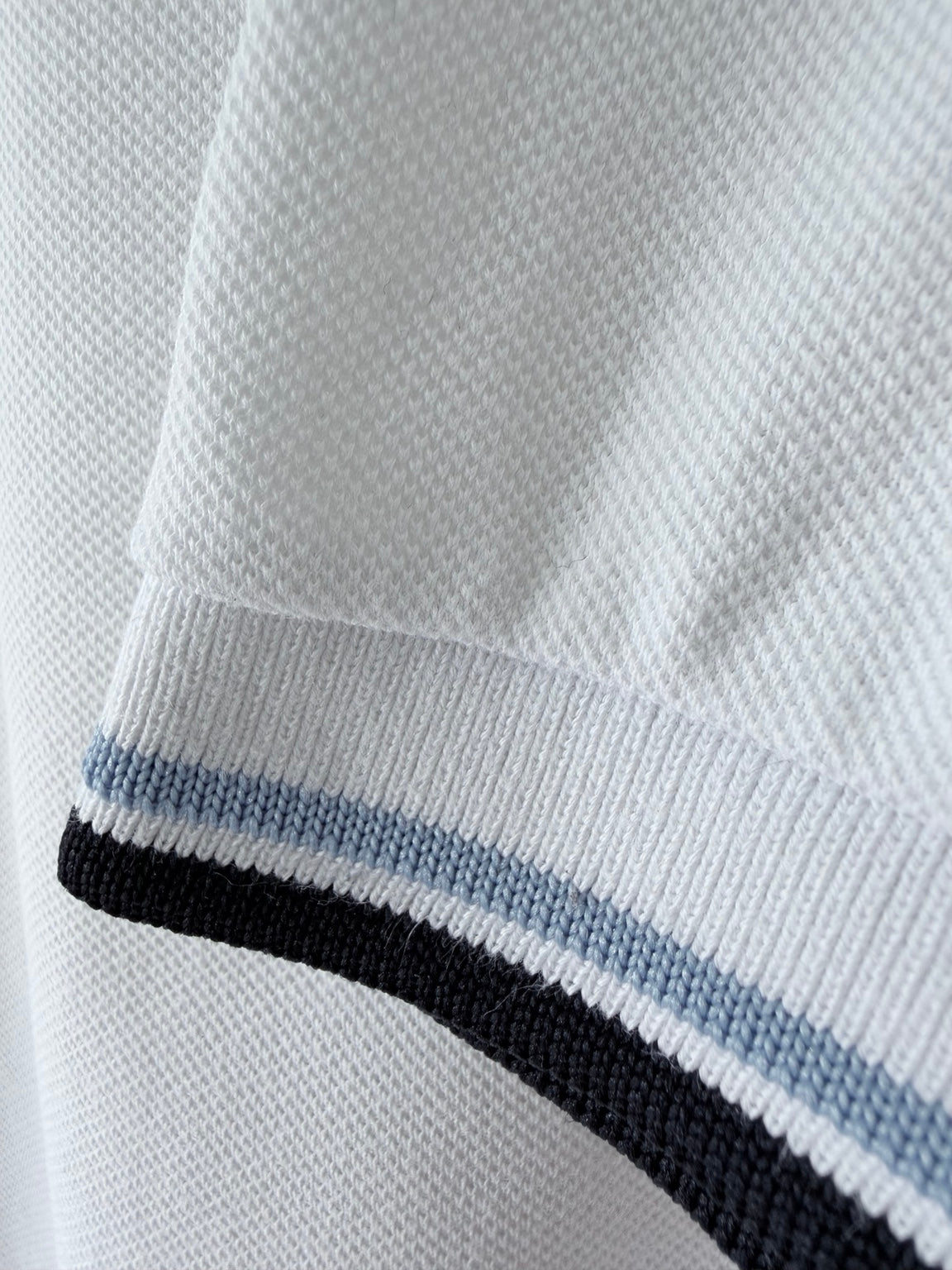 Fred Perry white polo sleeve trim detail
