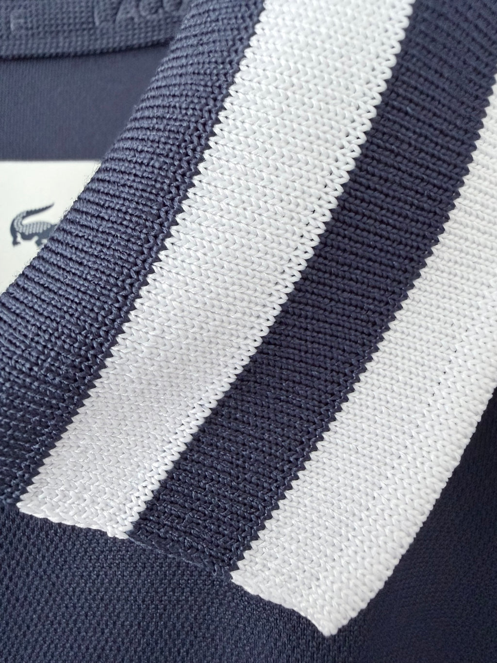 Lacoste Sport navy and white striped collar detail