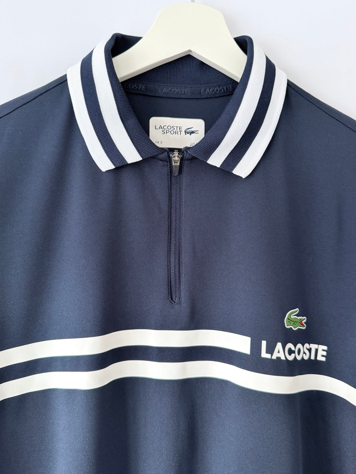 Lacoste Sport navy quarter zip polo shirt chest detail
