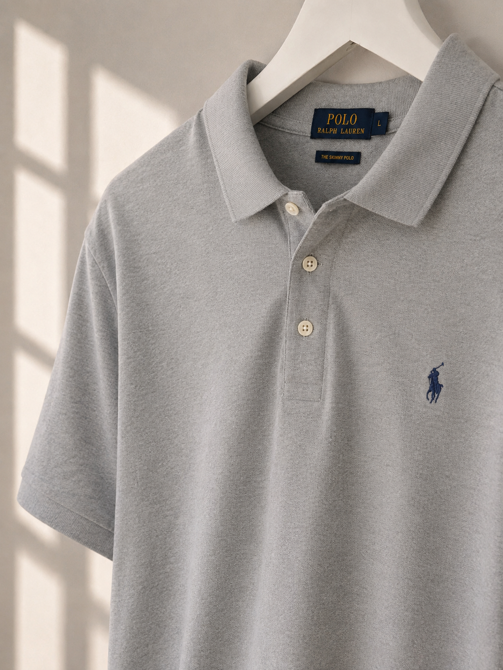 Polo Ralph Lauren grey Skinny Fit polo shirt size L on hanger in natural light